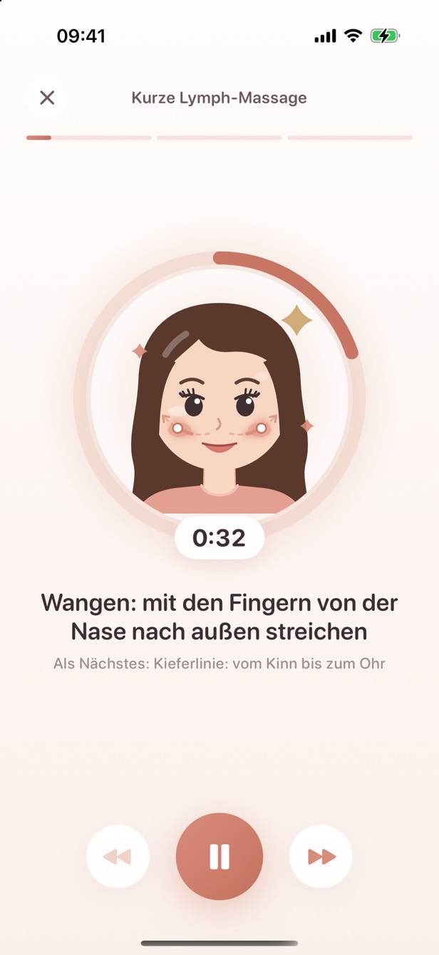 Der Player mitten in der Lymph-Massage: auf dem Gesicht läuft ein Punkt die Wangen entlang nach außen, darunter der Timer